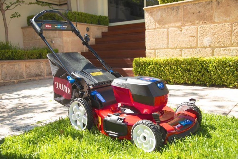 A Toro Lawn Mower is Sitting on Top of a Lush Green Lawn — R & M Motorcycles in Katherine, NT
