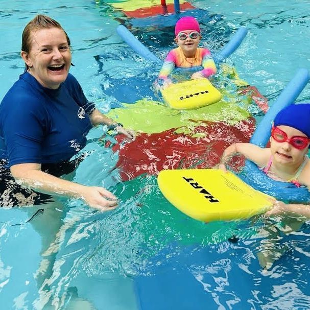 swim instructor with young learners 