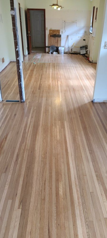 There is a wooden floor in the middle of the room.