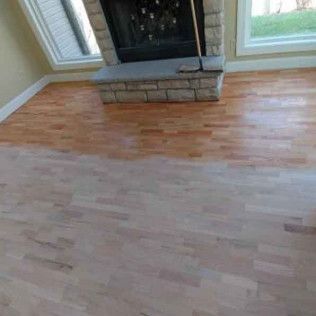 Living Room With Hardwood Floors and a Fireplace