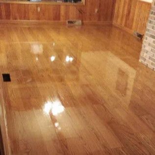 A Living Room With Hardwood Floors and a Fireplace