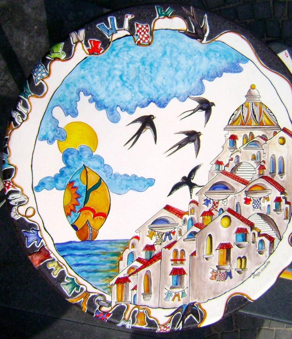 piatto in pietra lavica con paesaggio raffigurato