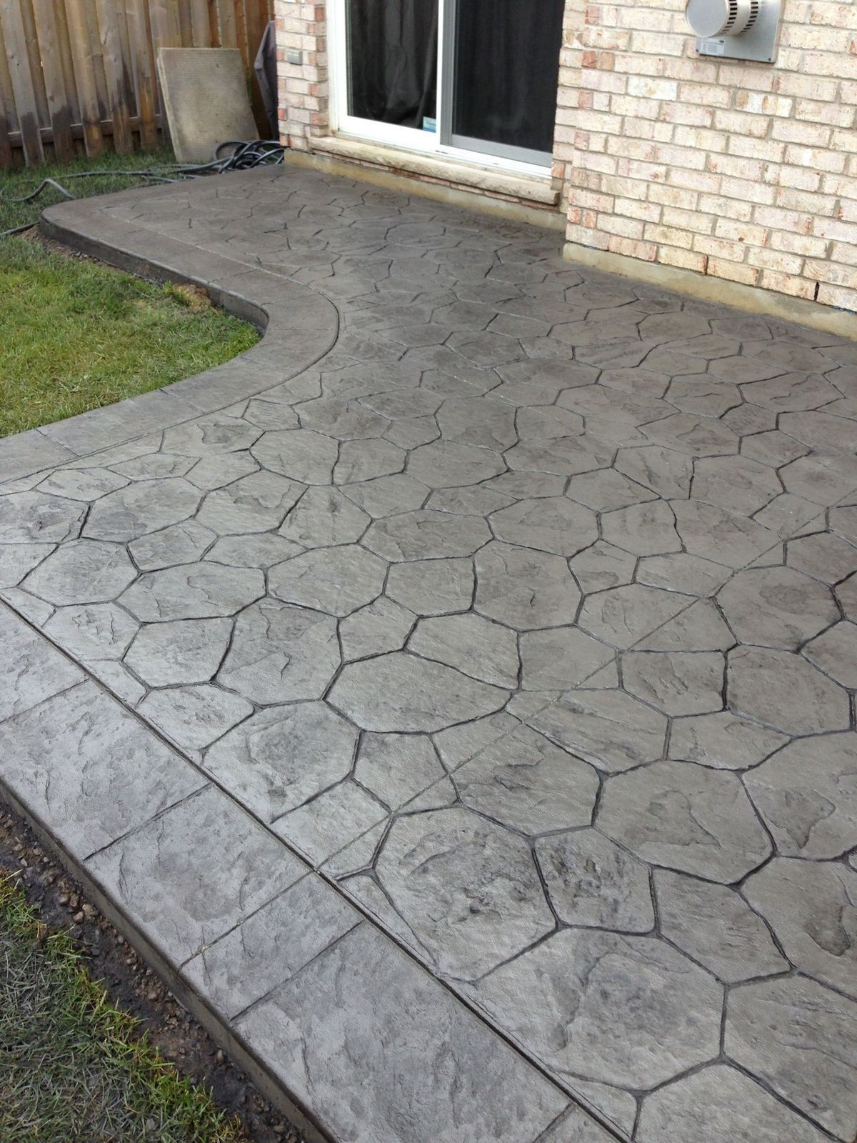 New decorative stamped concrete patio completed by Coastline Concrete in Orange County, California.