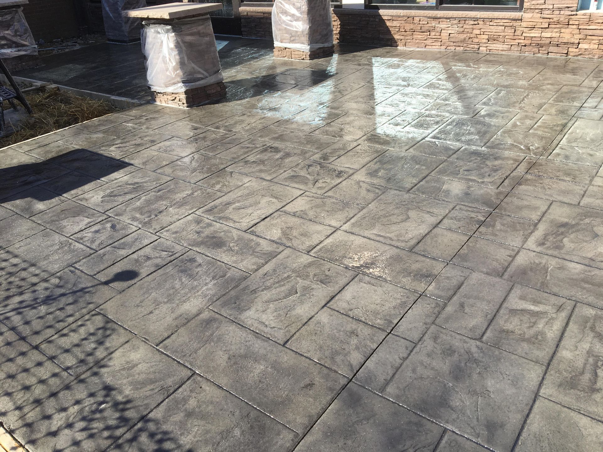 Decorative stamped concrete driveway installed by Coastline Concrete in Orange County, California.