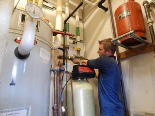 Replacement — Man Checking Boiler in Austin, TX