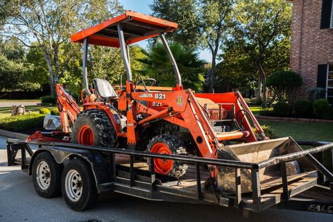 Water &  Sewer Replacements  — Red Backhoe in Austin, TX