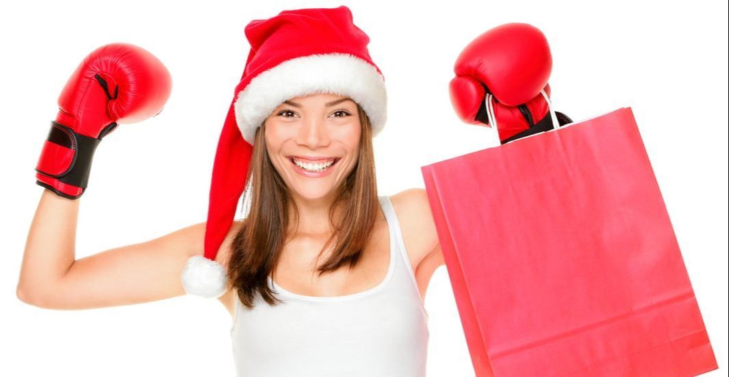 Woman with boxing gloves celebrating Boxing Day and Christmas Sales & E-Commerce