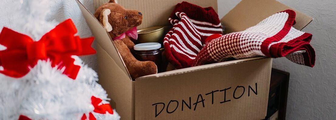 Box of Christmas donations and gifts