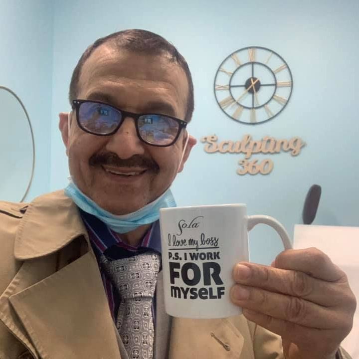 Dr.Samara holding a mug