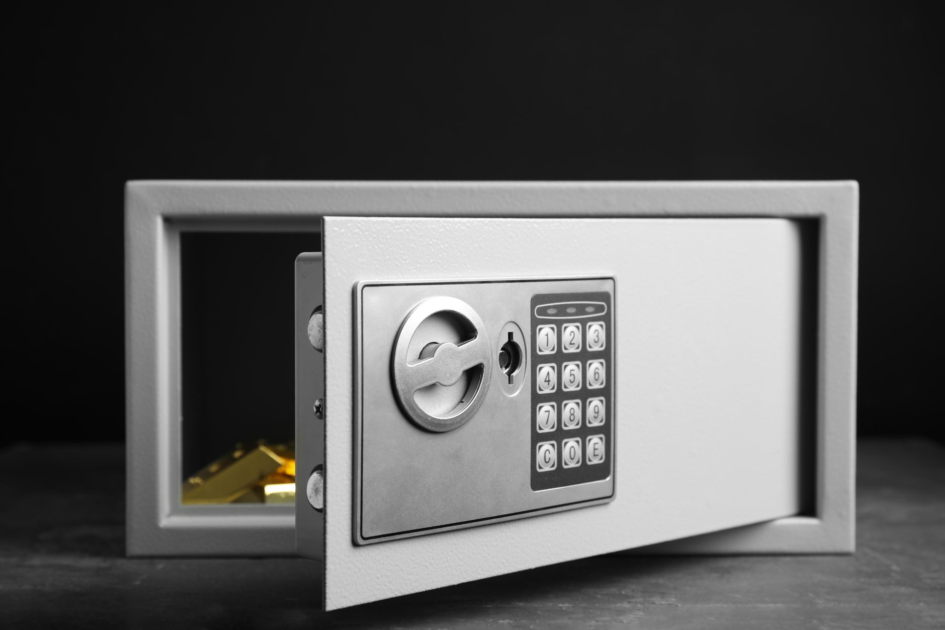 a digital safe with a gold bar inside of it .
