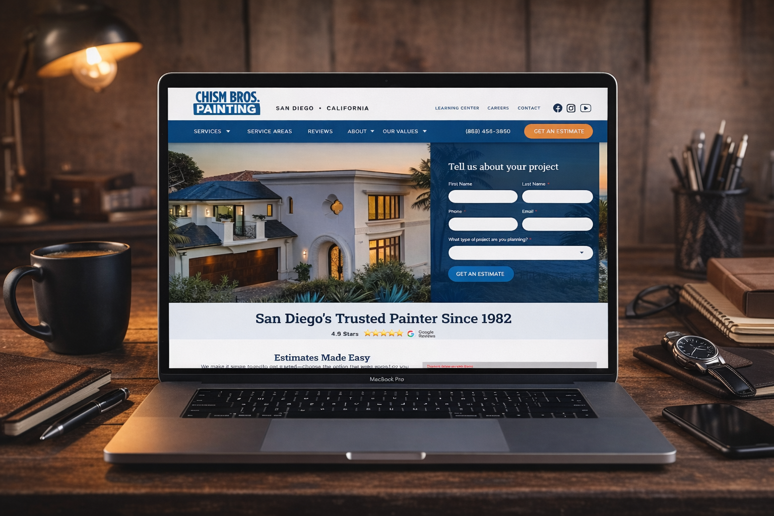 Laptop on desk showing a travel website with hotel booking form and seaside resort photo