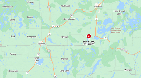 A digital map shows the location of Birchwood, Wisconsin, marked with a red pin, surrounded by several small lakes.