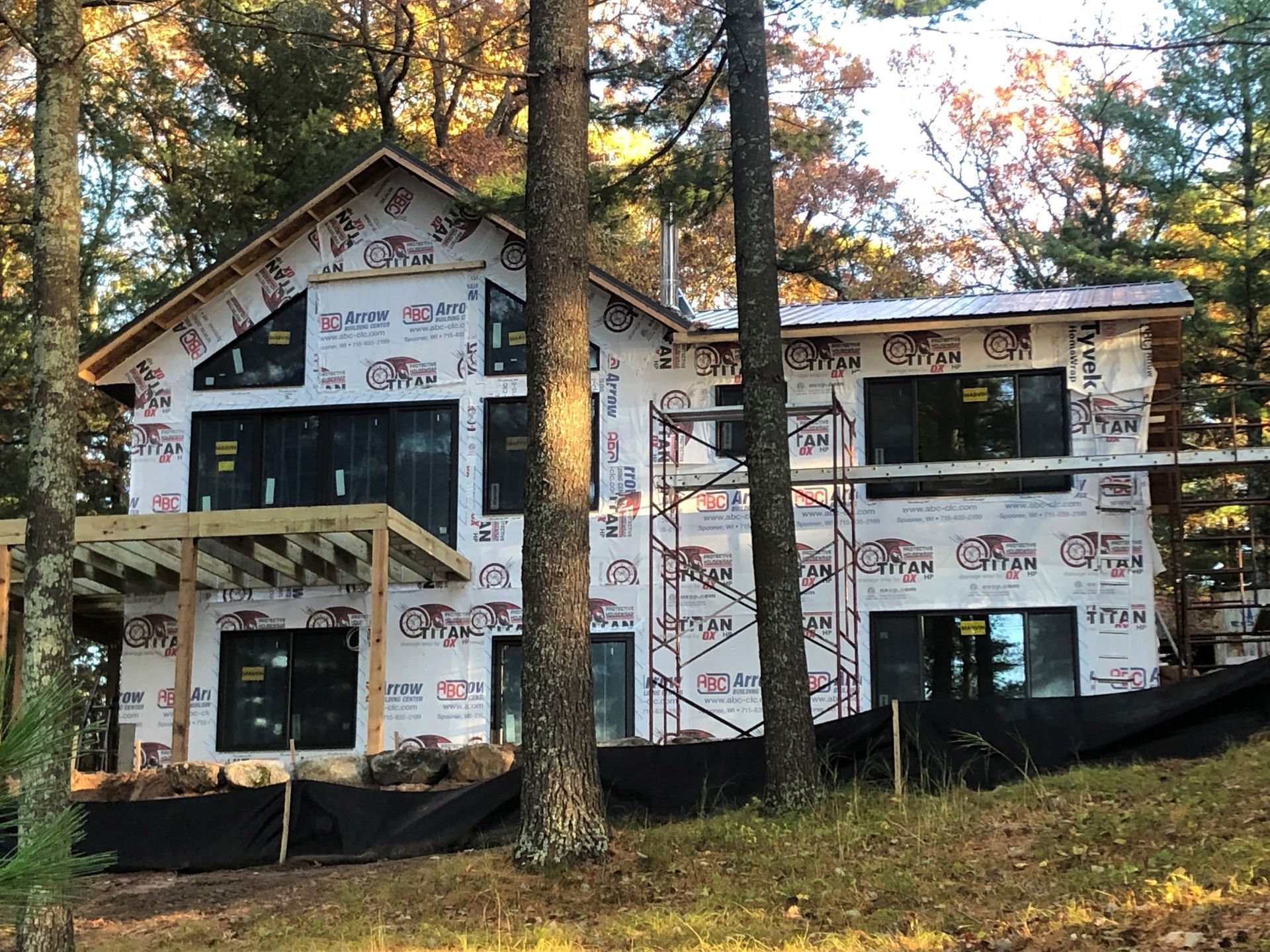 A house is being built in the middle of a forest.
