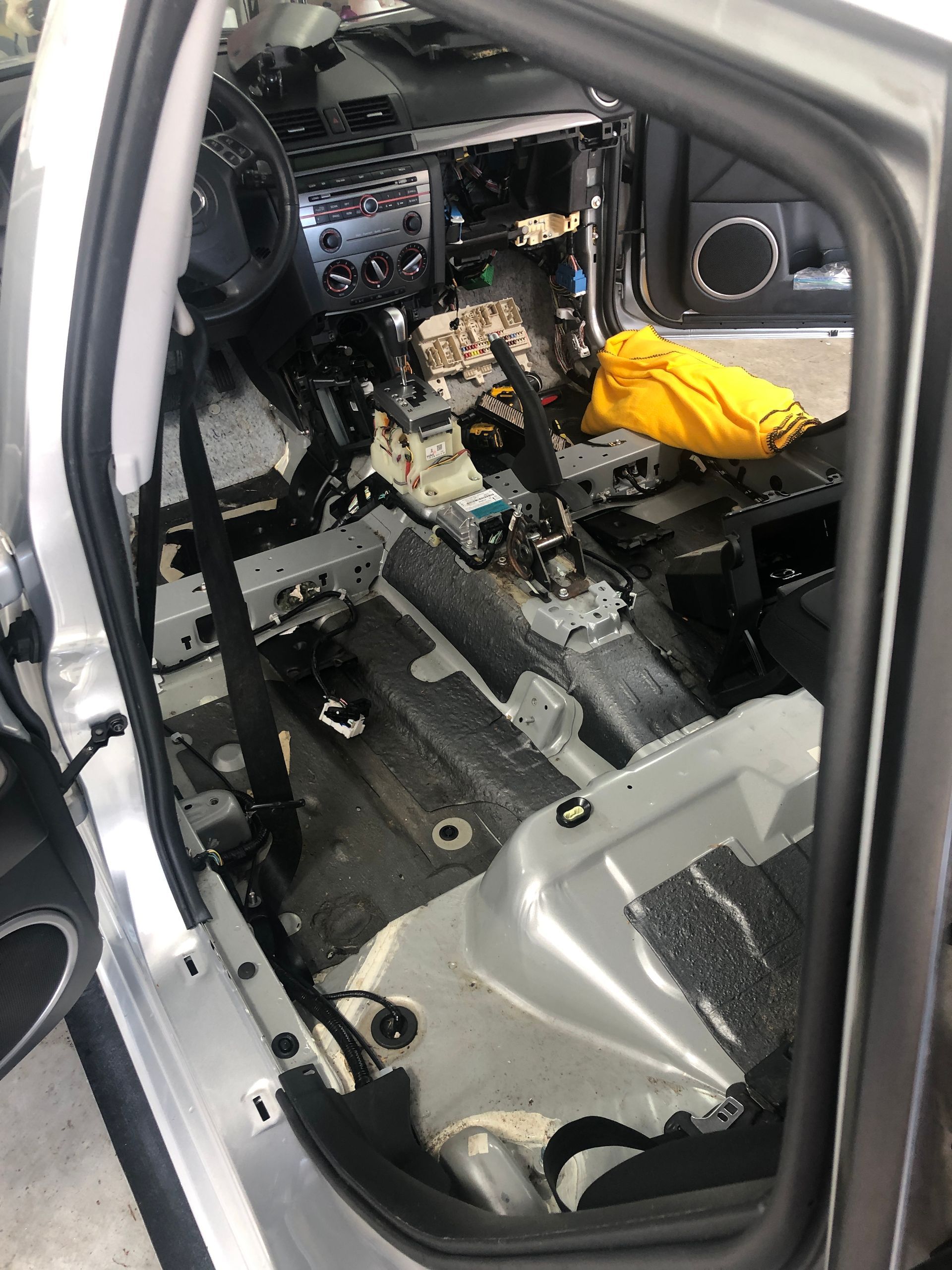 The inside of a car is being dismantled.