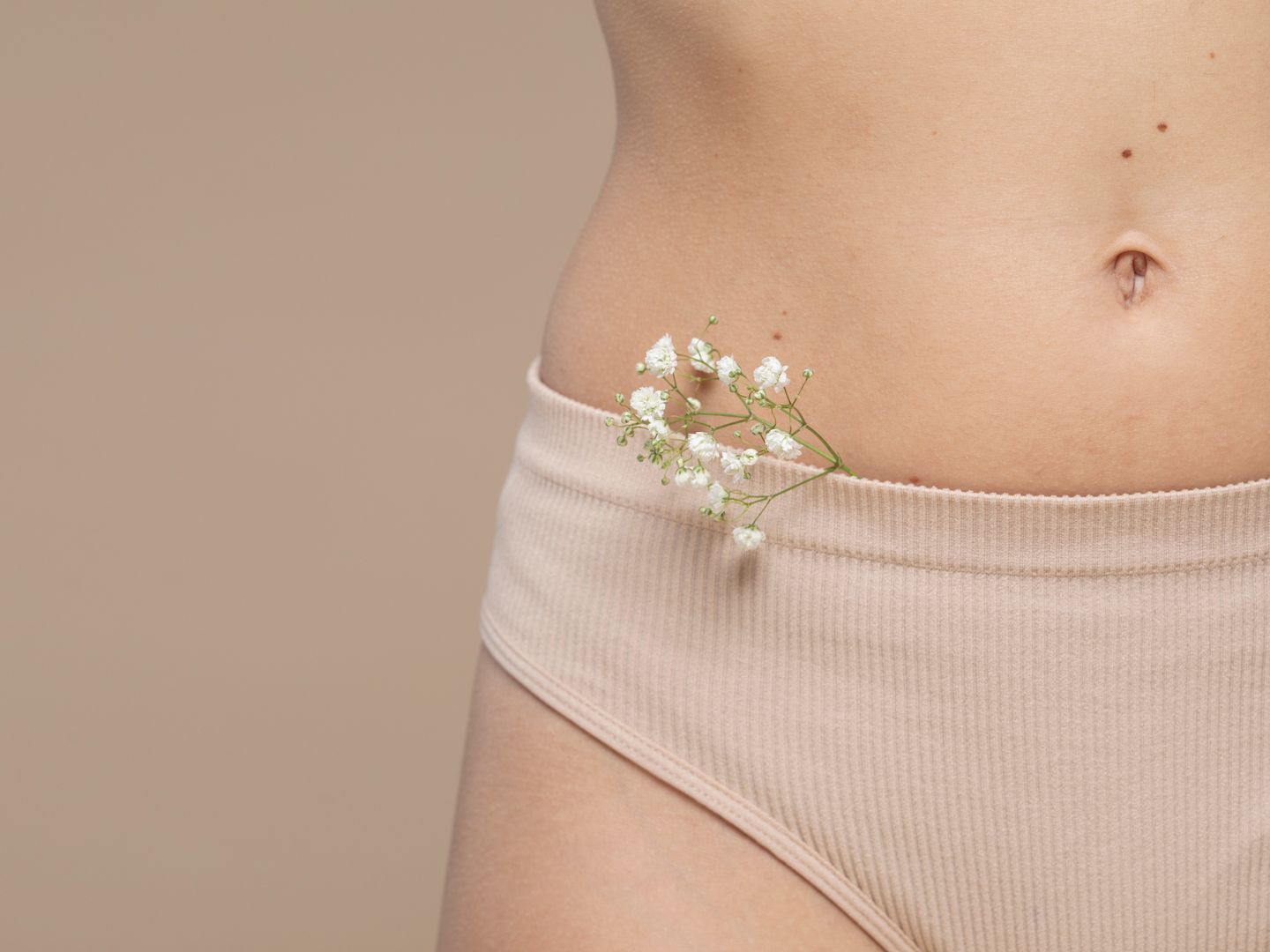 woman in underwear with a flower