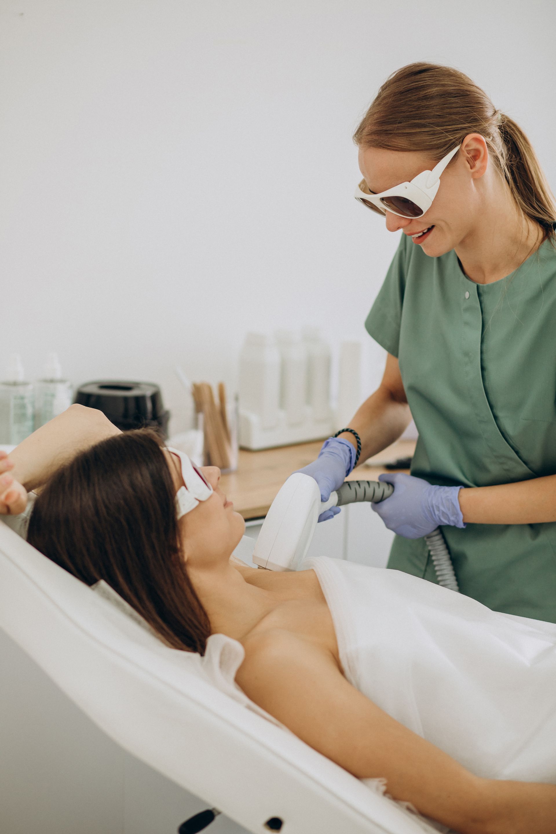 woman doing laser hair removal treatment