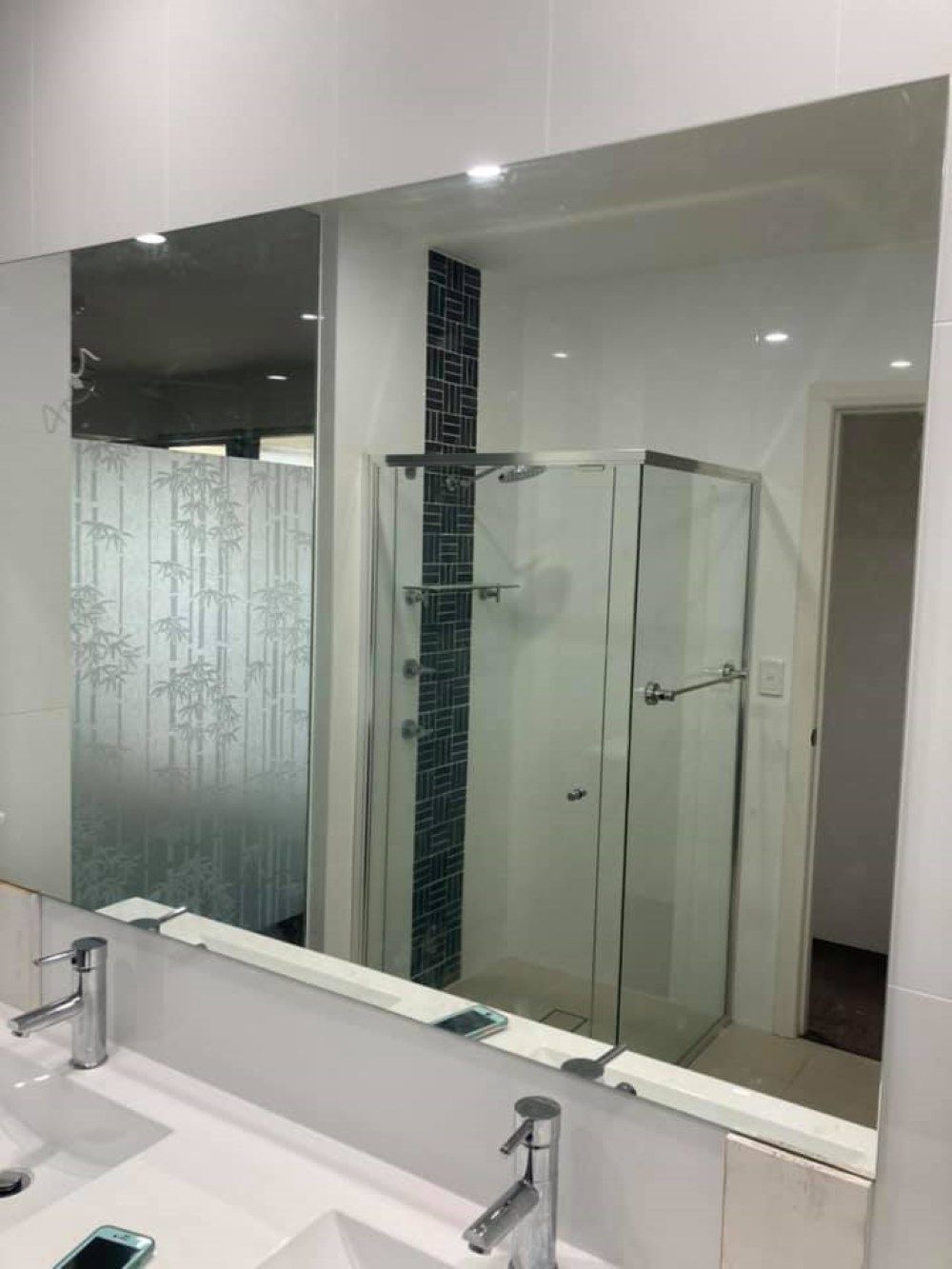 A Bathroom with A Large Mirror and A Shower Stall — Boambee Gauze 'n' Glass in Harbour, NSW