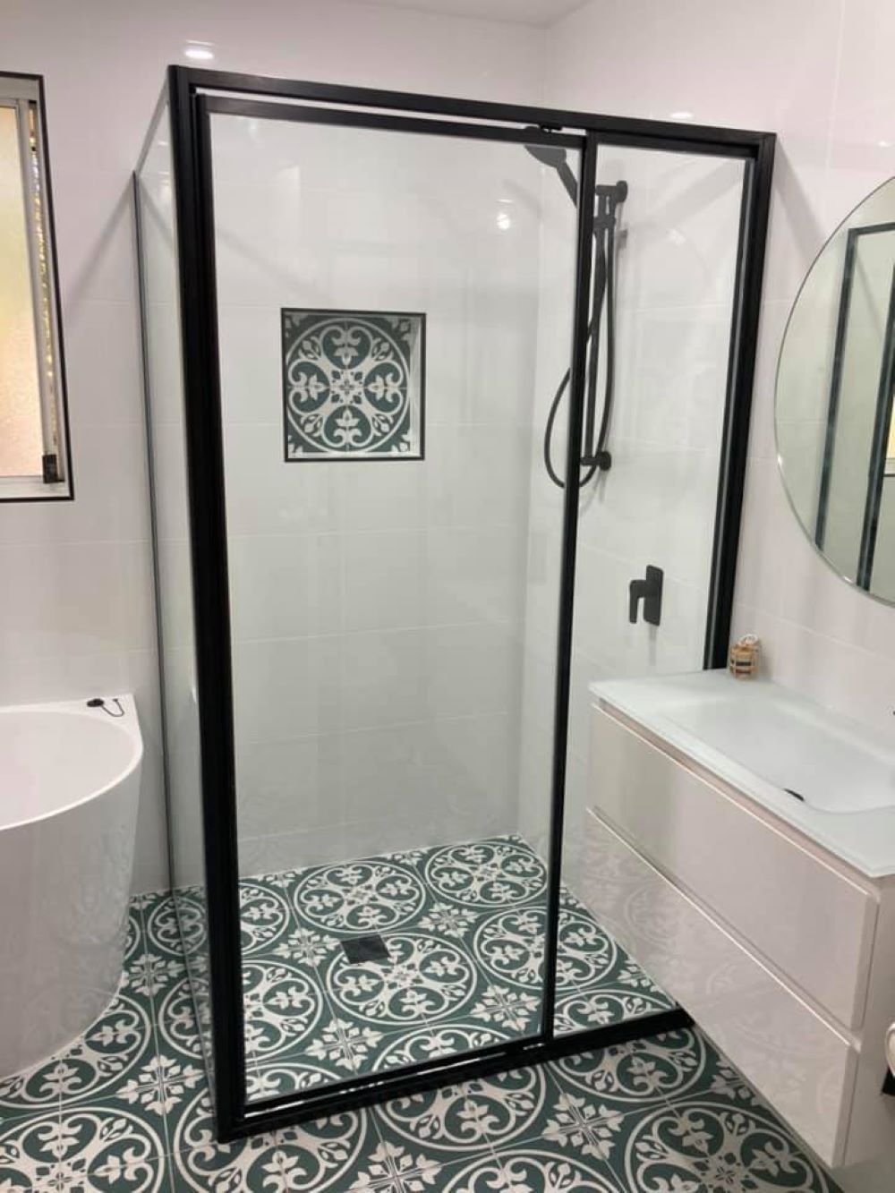 A Bathroom with A Shower, Sink, and Bathtub — Boambee Gauze 'n' Glass in Harbour, NSW