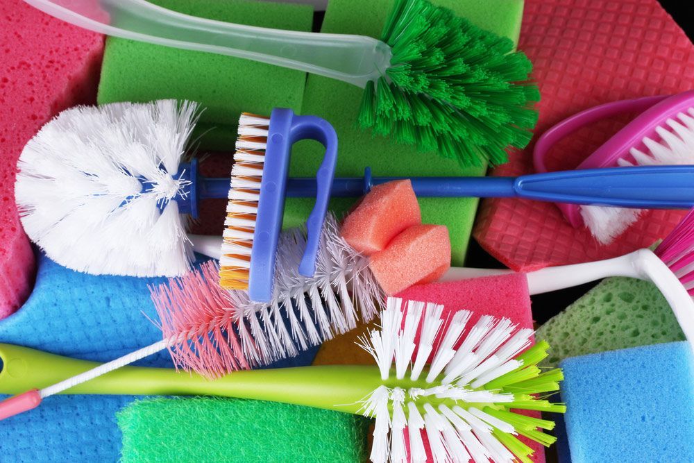 A Bunch Of Cleaning Supplies Including Brushes And Sponges — AGB Cleaning In Bentley Park, QLD