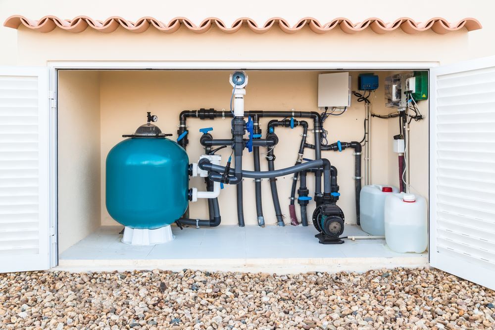 A Swimming Pool Filter is Sitting Inside of a Garage — Figleaf Pool Products in Palmerston, NT