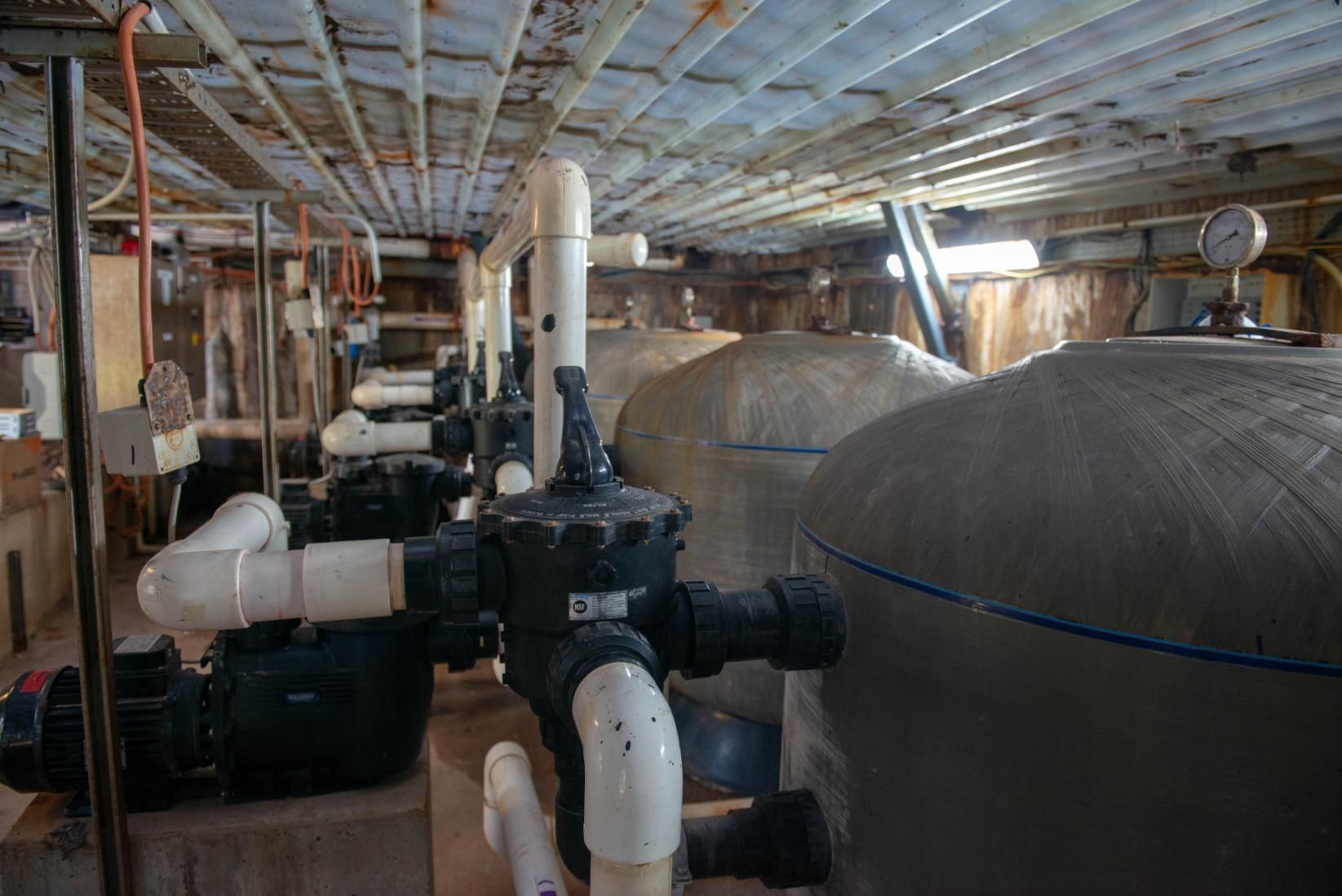 A Room Filled with Lots of Pipes and Pumps — Figleaf Pool Products in Coconut Grove, NT