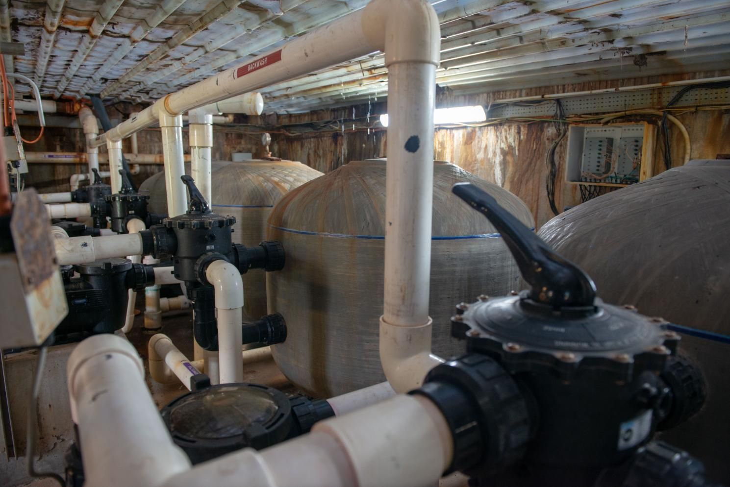 A Room Filled with Lots of Pipes and Valves — Figleaf Pool Products in Coconut Grove, NT