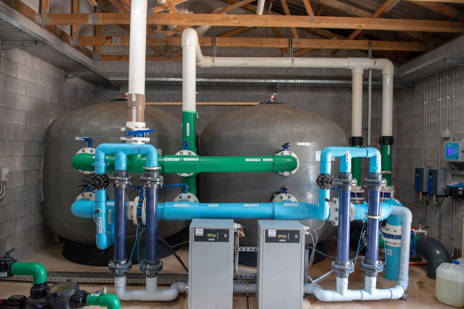 A Room Filled with Lots of Pipes and Tanks — Figleaf Pool Products in Coconut Grove, NT