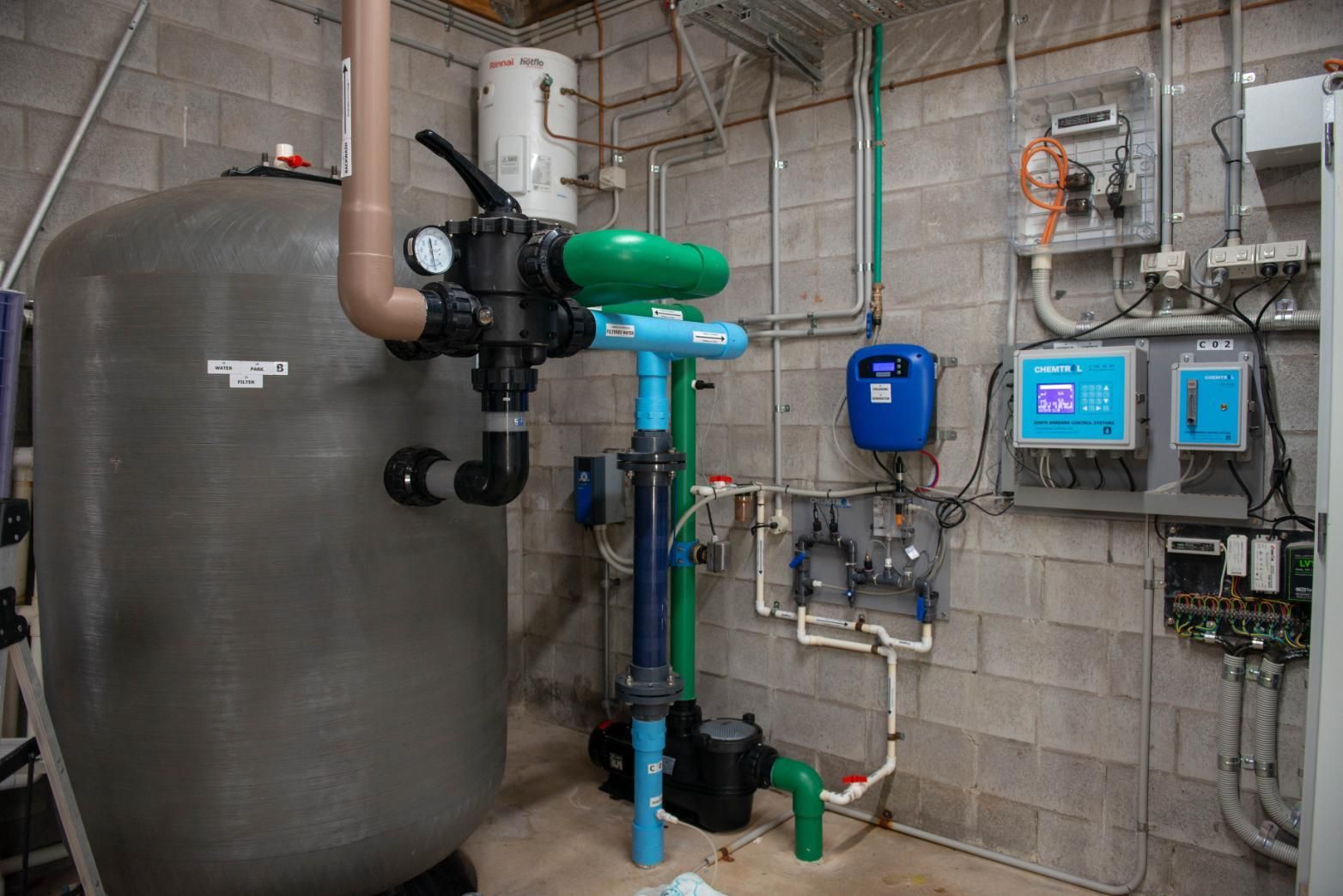 A Room Filled with Lots of Pipes and A Large Tank — Figleaf Pool Products in Coconut Grove, NT