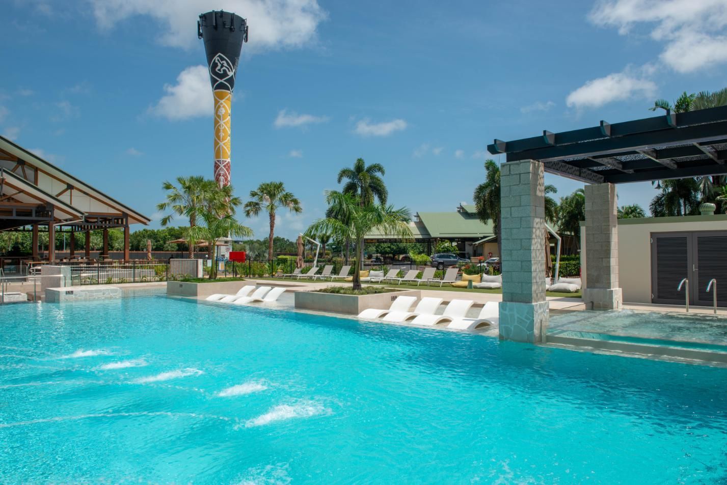 A Large Swimming Pool Is in Front of A Hotel — Figleaf Pool Products in Coconut Grove, NT