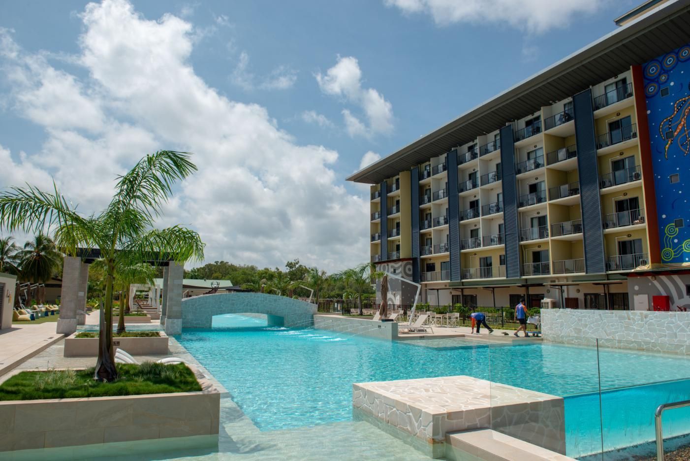A Large Swimming Pool Is in Front of A Hotel — Figleaf Pool Products in Coconut Grove, NT