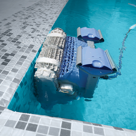 A Robotic Vacuum Cleaner is Floating in a Swimming Pool — Figleaf Pool Products in Coconut Grove, NT