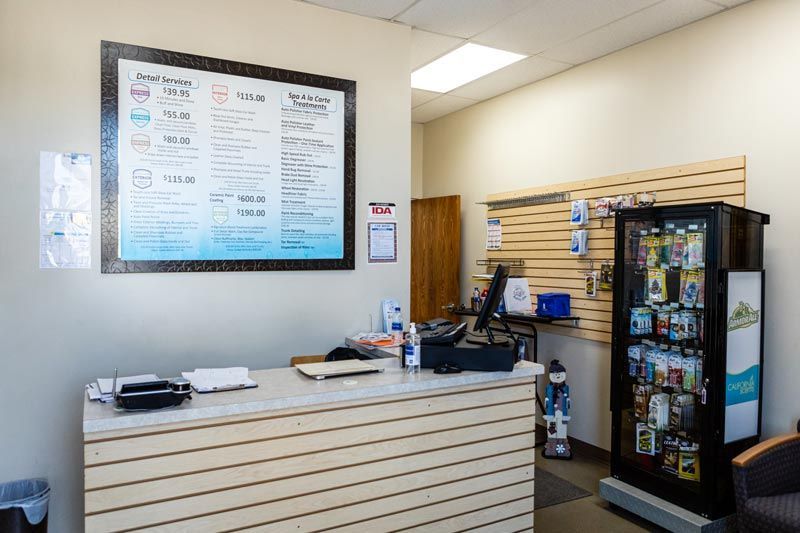 the inside of a store with a counter and a vending machine .