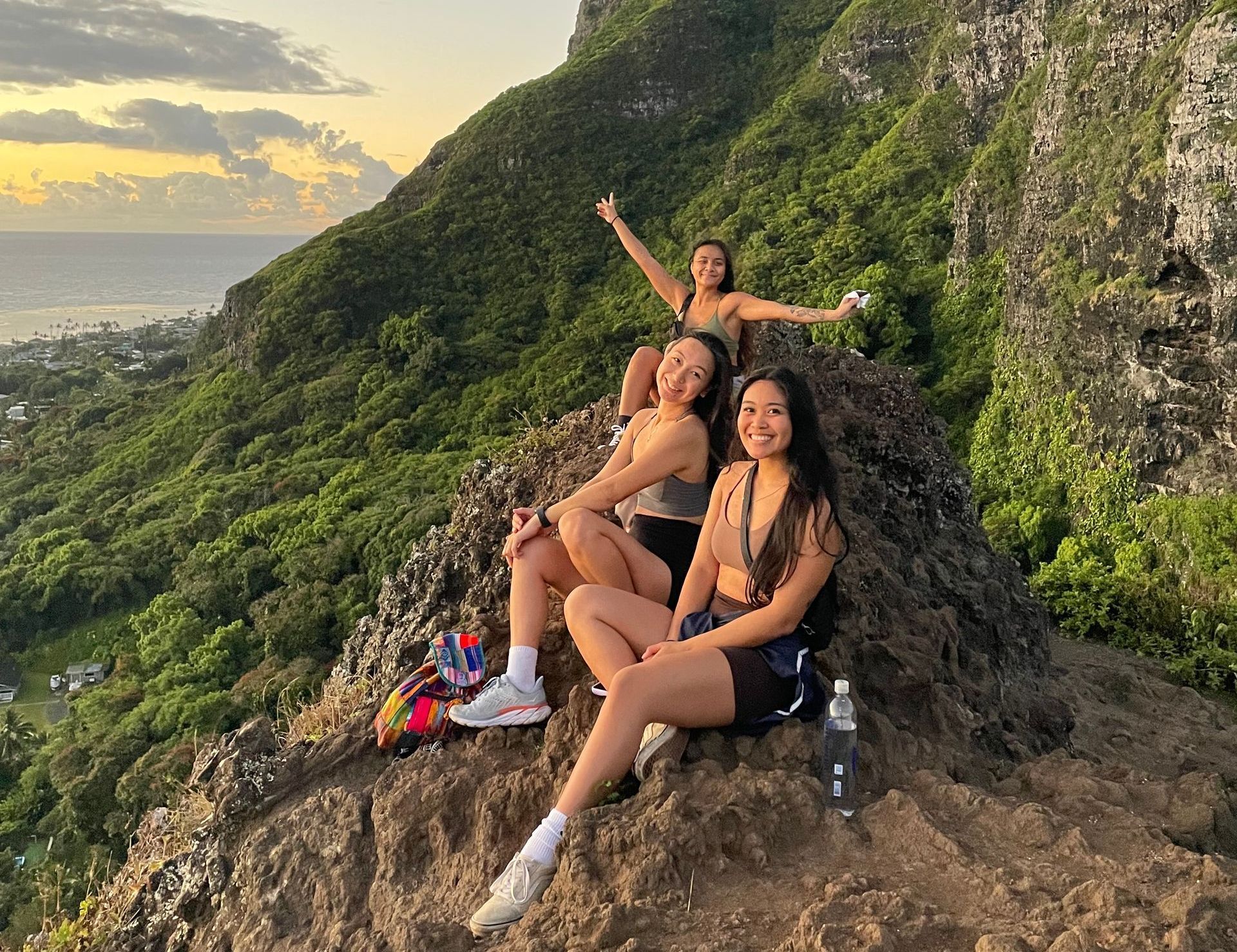 Group of girls hanging out on the mountainside in Hawaii