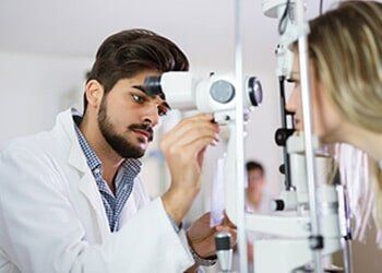 Optometrist checking patient eyesight and vision correction — general in Yorktown, VA
