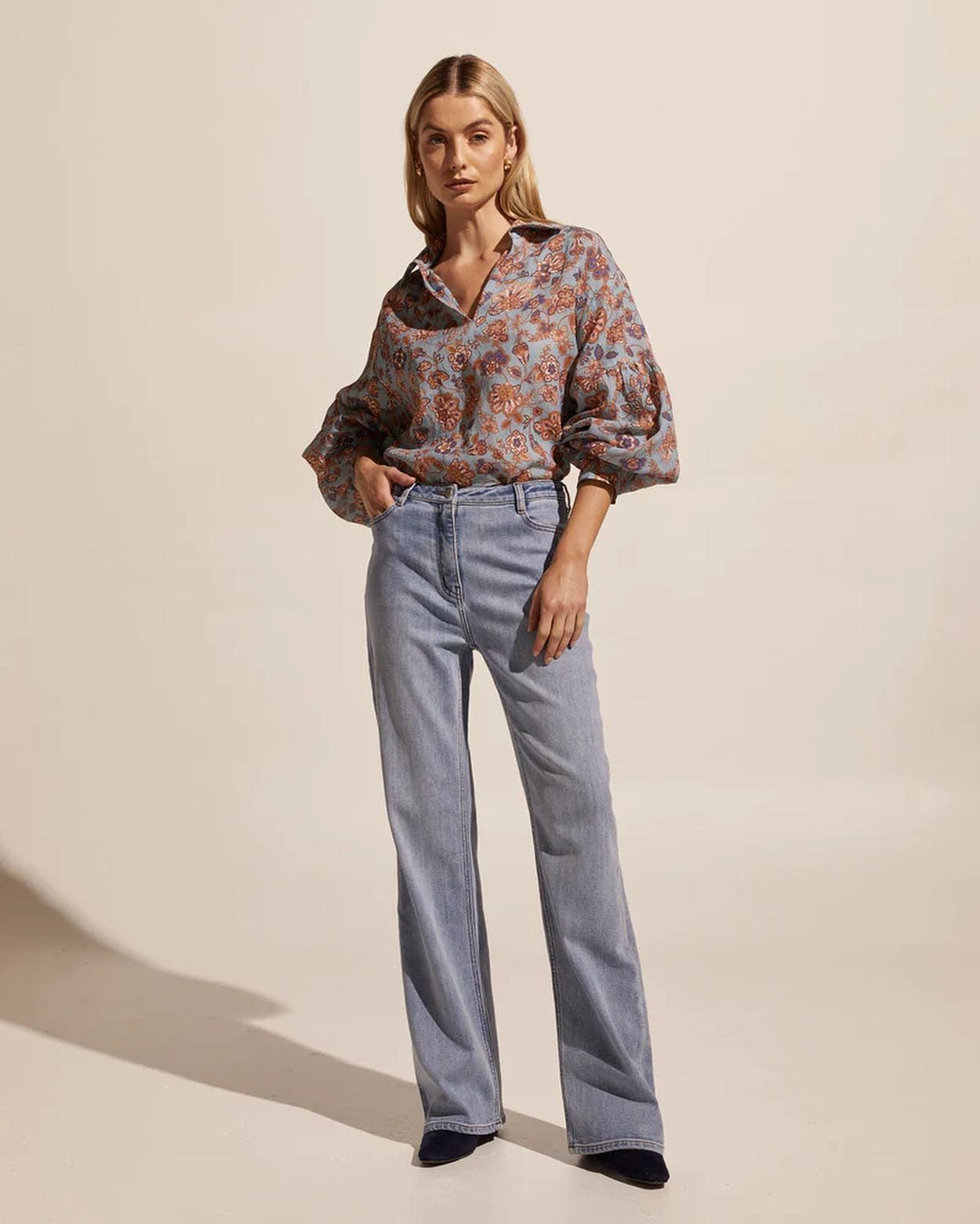 a Woman is Wearing a Floral Shirt and Jeans — Montaze In Erina, NSW