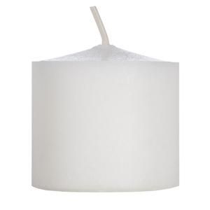 White pillar candle with a lit wick, isolated on a white background.