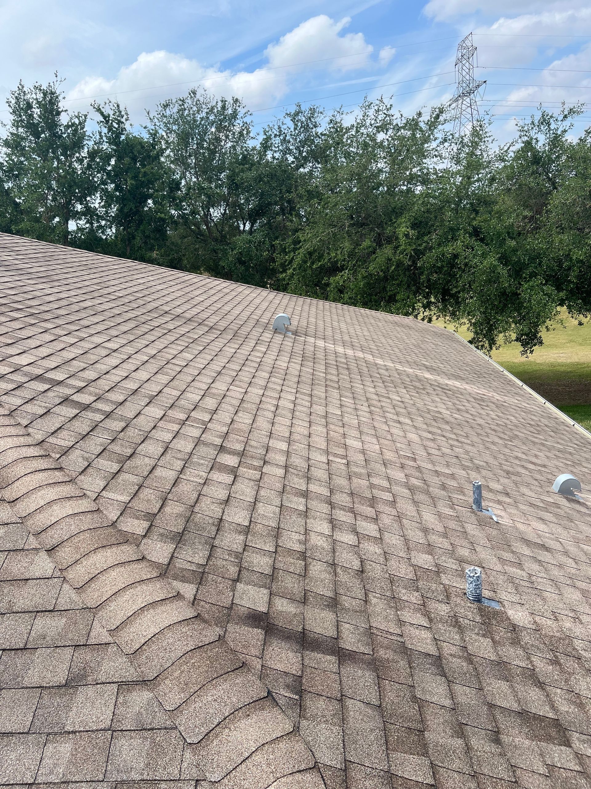 A close up of a brick walkway next to a pool.