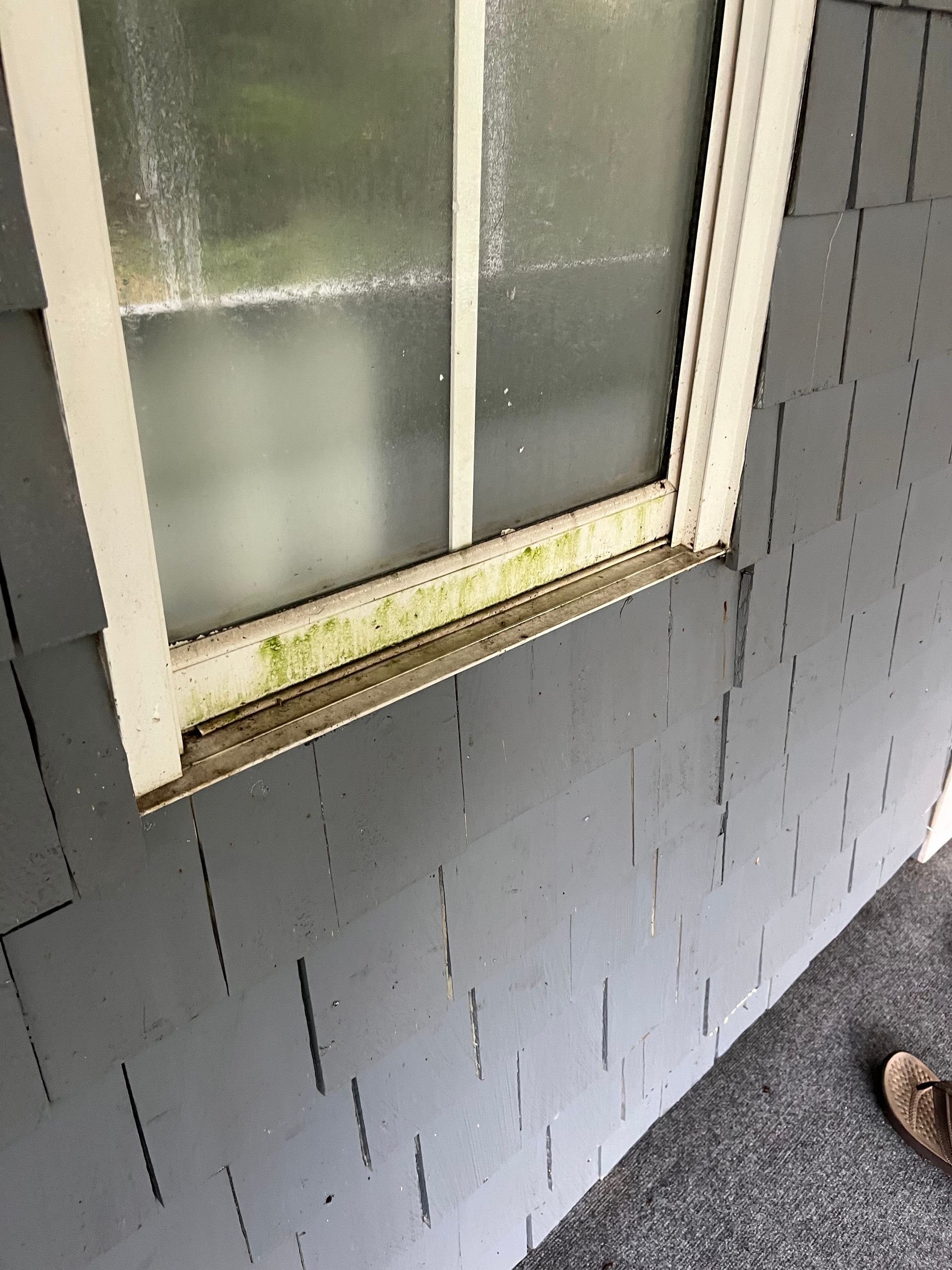 A white house with a blue sky in the background