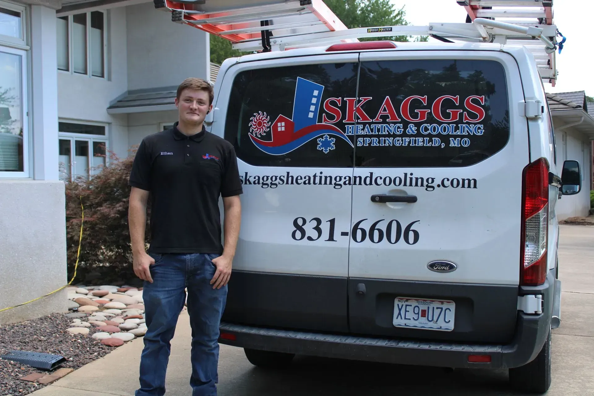 A man standing in front of a skaggs van