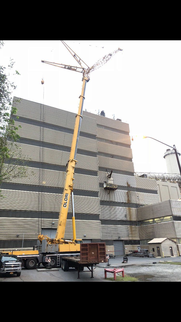 Crane Near Large Building — Nanuet, NY — Olori Crane Service, Inc.