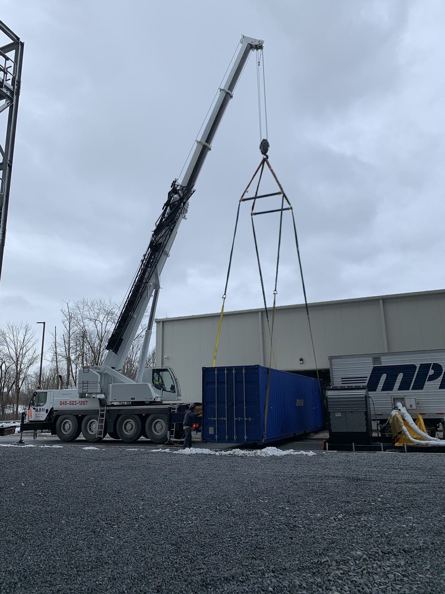 Crane Lifting Shipping Container — Nanuet, NY — Olori Crane Service, Inc.