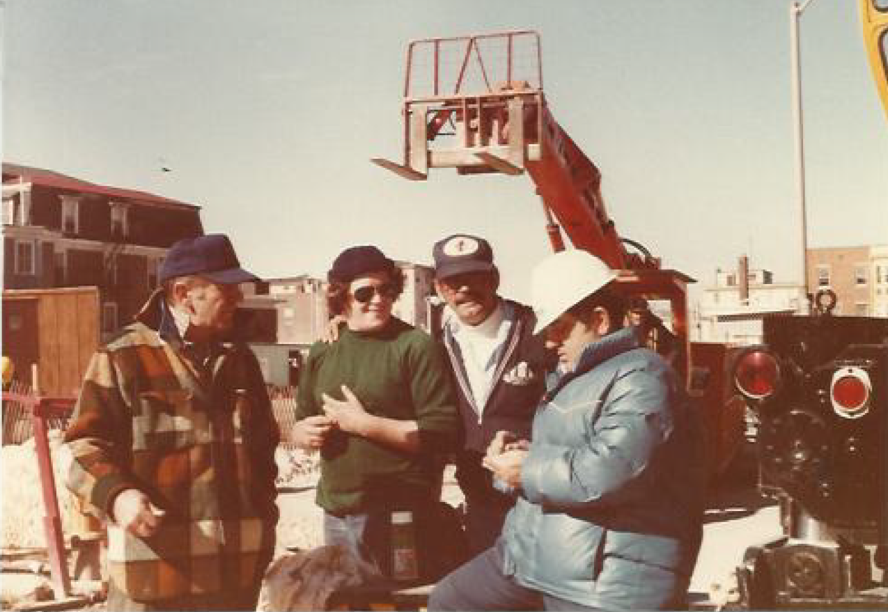 Group of Men with Crane Behind Them — Nanuet, NY — Olori Crane Service, Inc.