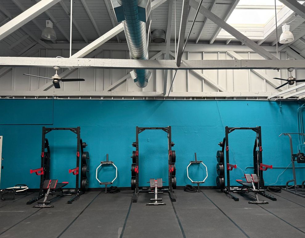 The Unbound Fitness studio floor with racks and open training space