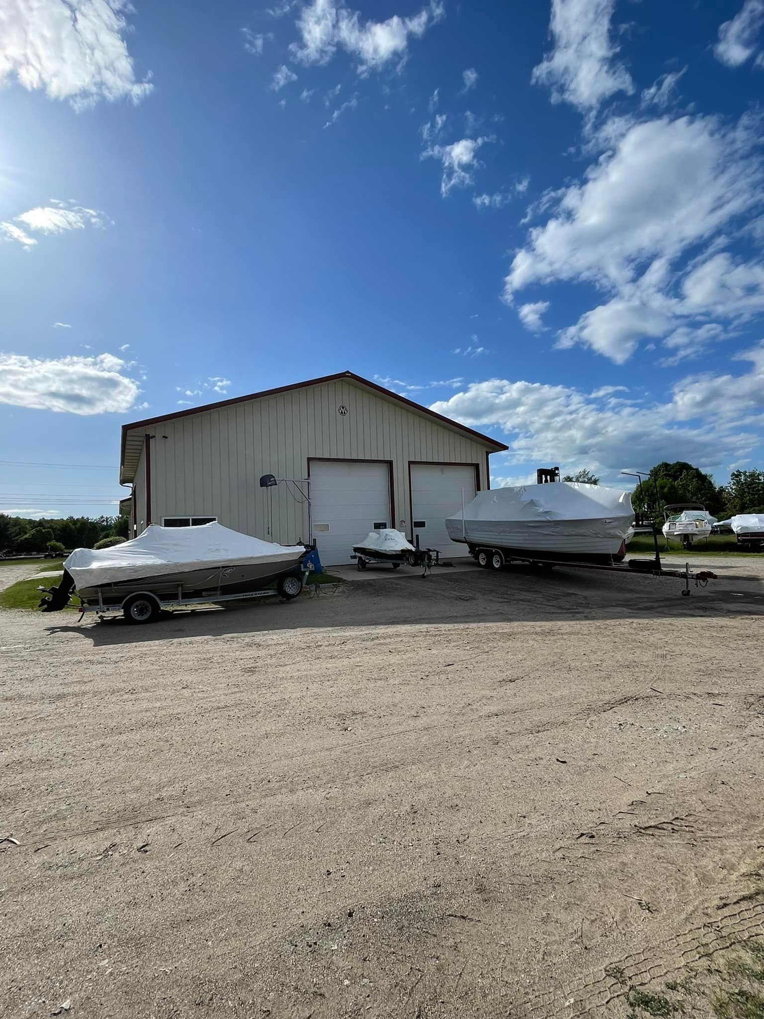 A couple of boats are parked in front of a building.