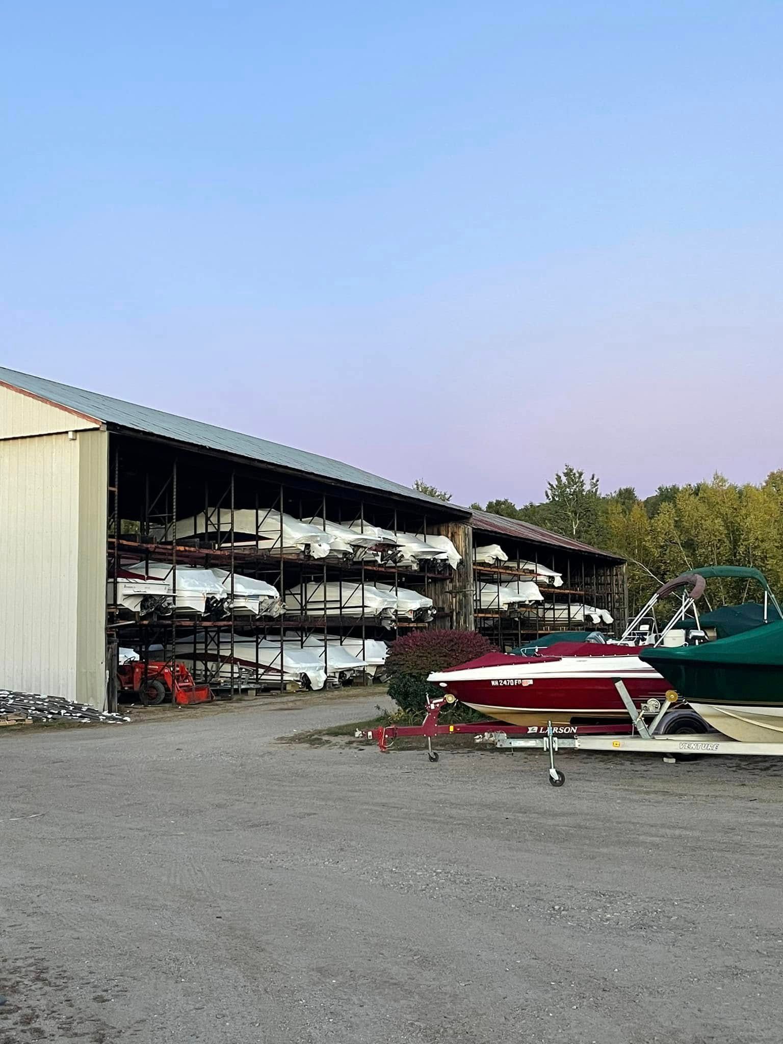 A lot of boats are parked in front of a building.