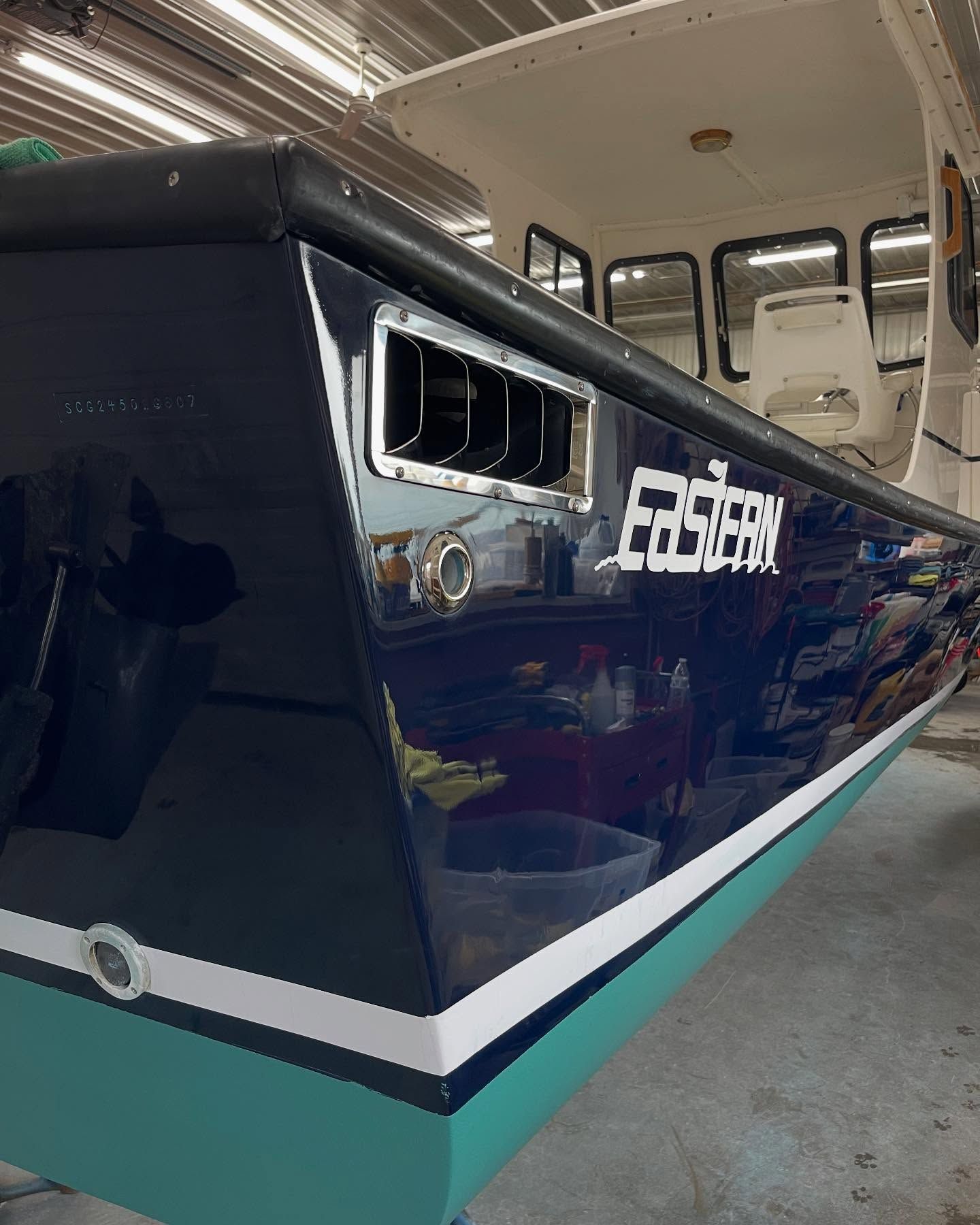 A boat with the word faster on the side of it