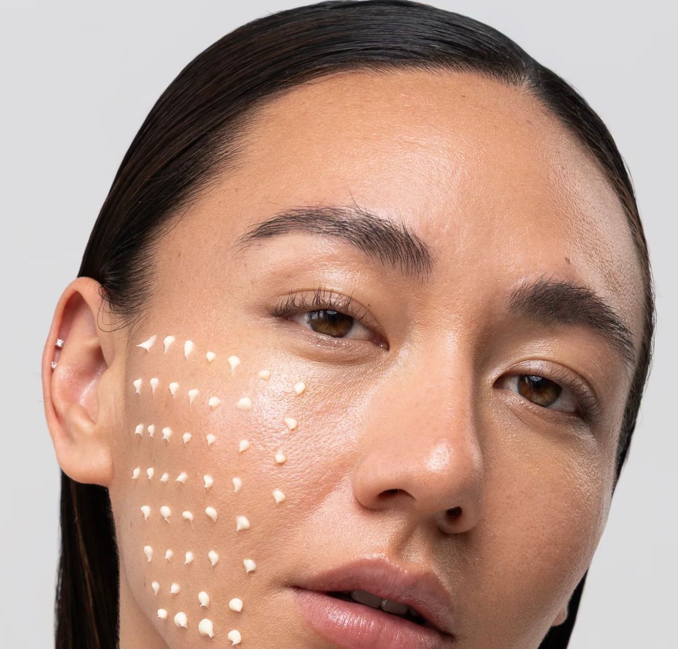 A table with a mirror and a candle on it