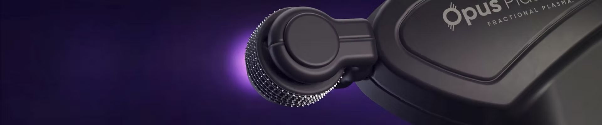 A close up of a black object on a purple background.