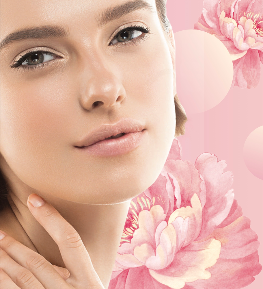 A close up of a woman 's face with pink flowers in the background