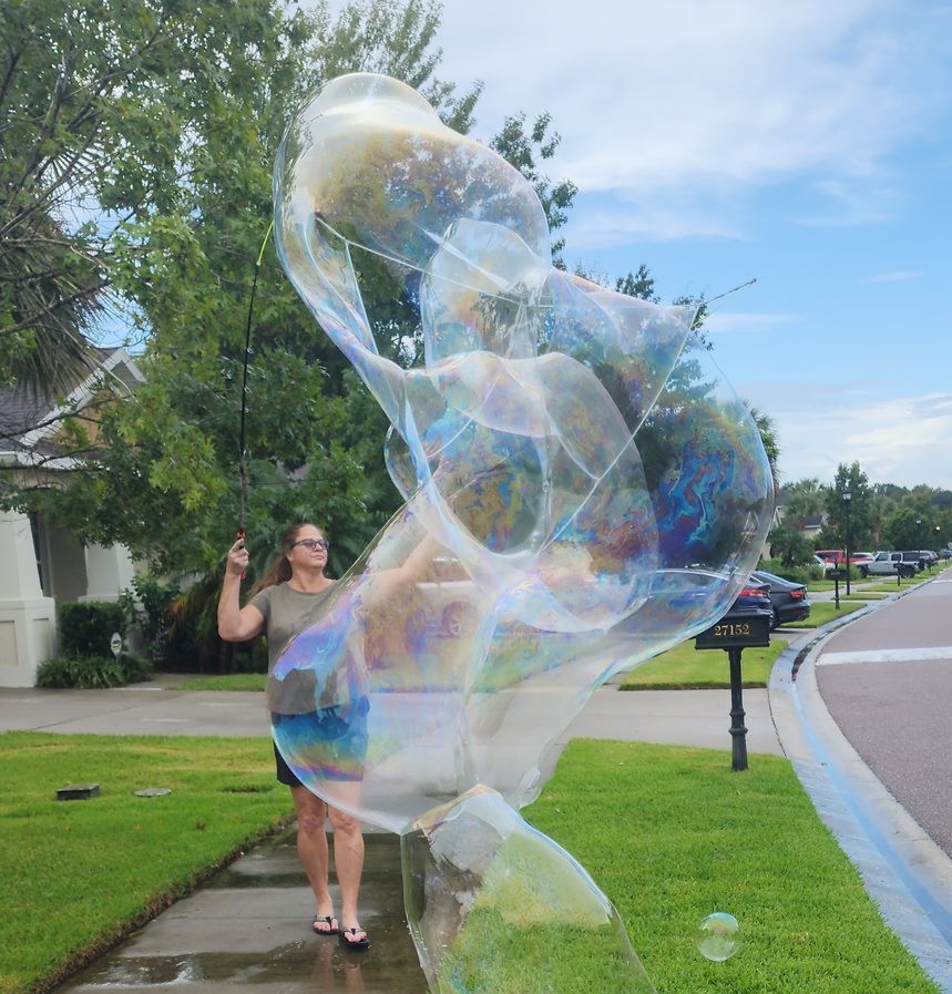Lady using large bubble net outdoor
